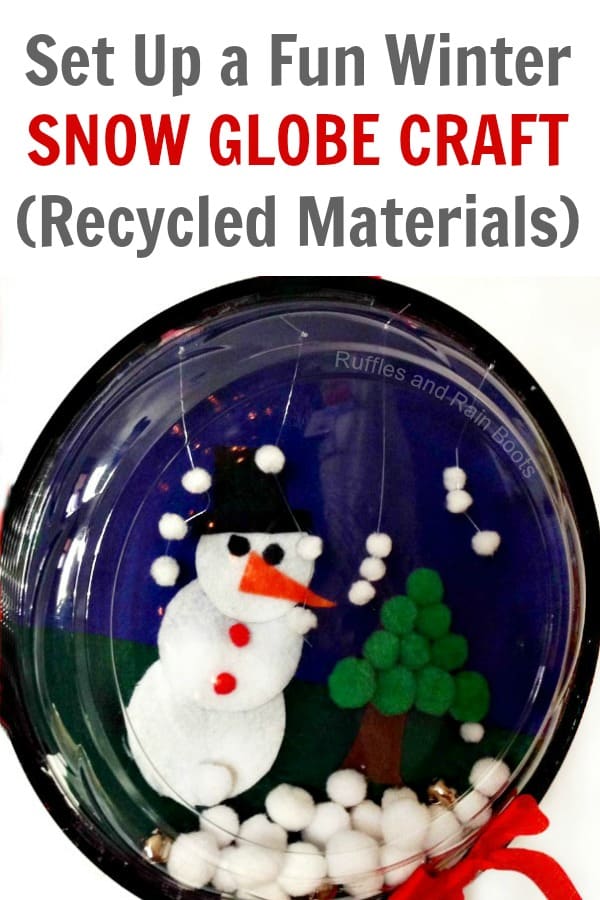 Make this fun, quick, and easy snow globe craft for kids. It's a great winter craft for preschoolers and uses recycled materials. #snowglobe #wintercrafts #wintercraftsforkids #snowman #snowmancrafts #holidaycrafts #snowglobeforkids #pompoms #feltcrafts #recycledcrafts #DIYrecycle #rufflesandrainboots