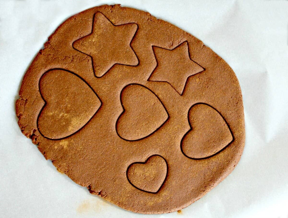 cut shapes in the cinnamon ornament dough for holiday decor