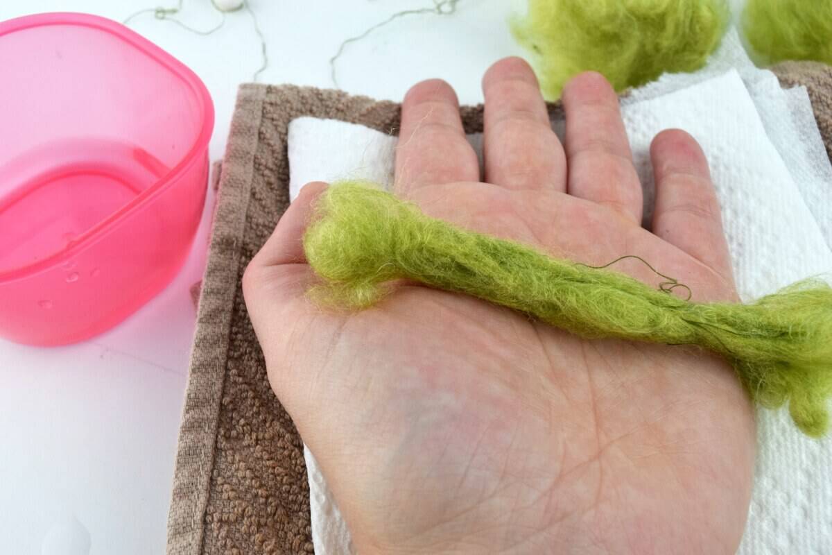 Roll yarn with water to create faux fur or hair for a female gnome