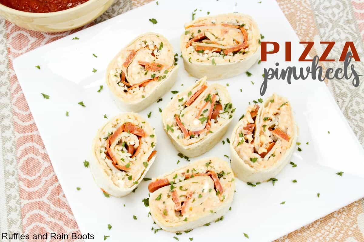 https://rufflesandrainboots.com/wp-content/uploads/2018/07/Pizza-Pinwheels-Recipe-for-Weeknight-Dinner-Back-to-School-Lunch-or-Appetizer.jpg