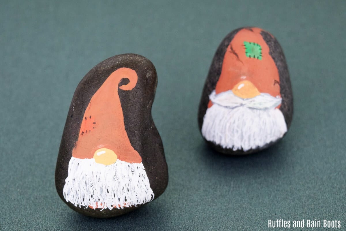 These Thanksgiving, harvest, or Fall gnome rock painting cuties are sure to bring the smiles. They are easy to make and fun to make a lot of which is why we now have a set! #rockpainting #rockpainting101 #rockpaintingideas #gnomes #storystones #howtopaintrocks #rockpaintingforbeginners #gnomecrafts #diygnomes #paintedpebbles #paintedstones #rufflesandrainboots