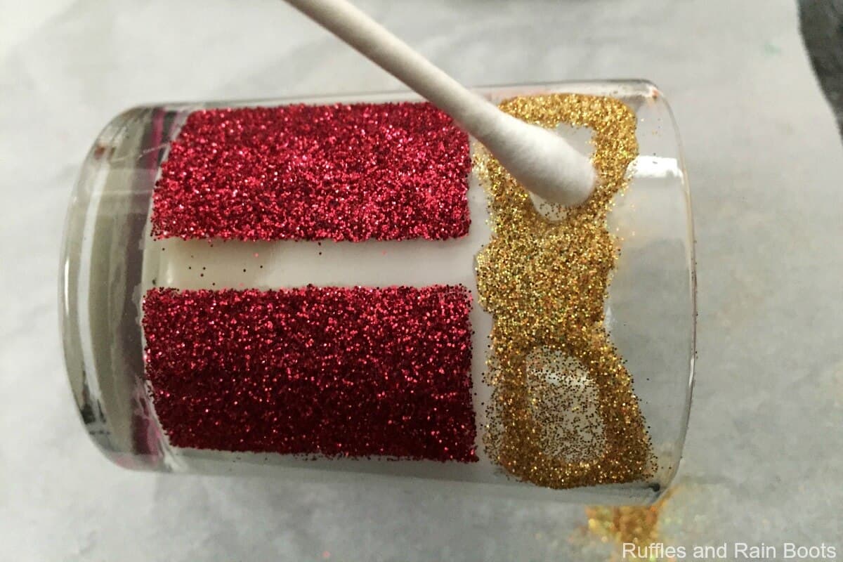 next apply the glitter and clean up anything with a dry cotton swab