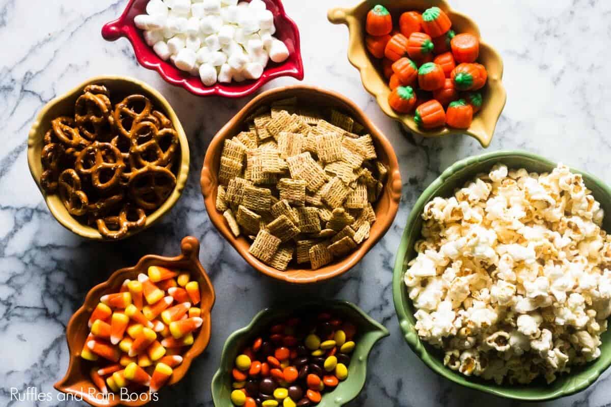 popcorn snack mix ingredients on a marble table