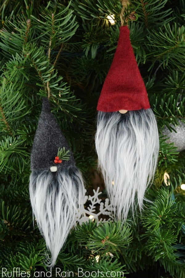 DIY Christmas Gnome Ornaments made with simple craft supplies hanging on Christmas tree.