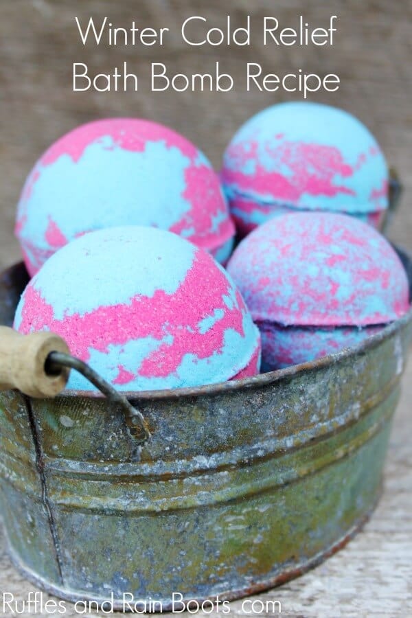 pink and blue bath bombs with decongestant recipe with text which reads winter cold relief bath bombs recipe