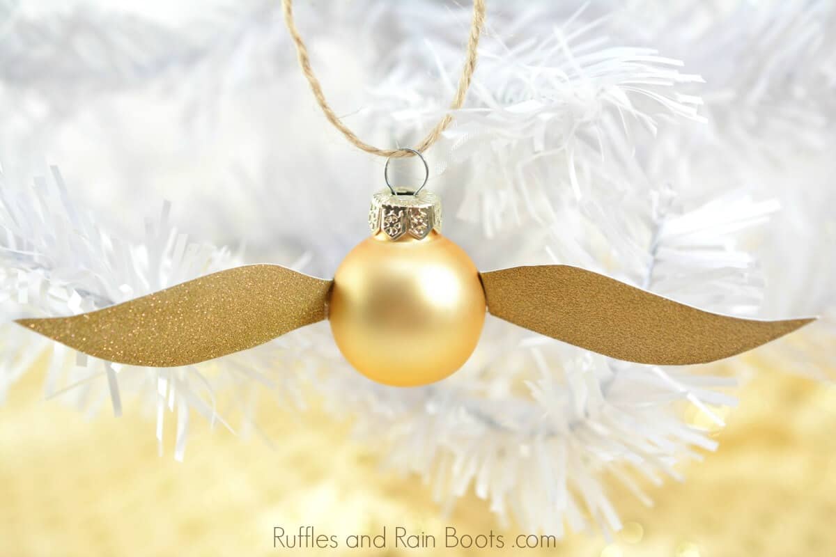 Golden Snitch Ornament DIY Harry Potter Craft against white Christmas tree