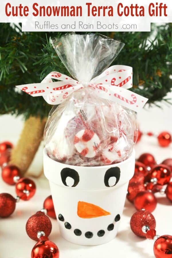 snowman painted clay pot with text which reads cute snowman terra cotta gift