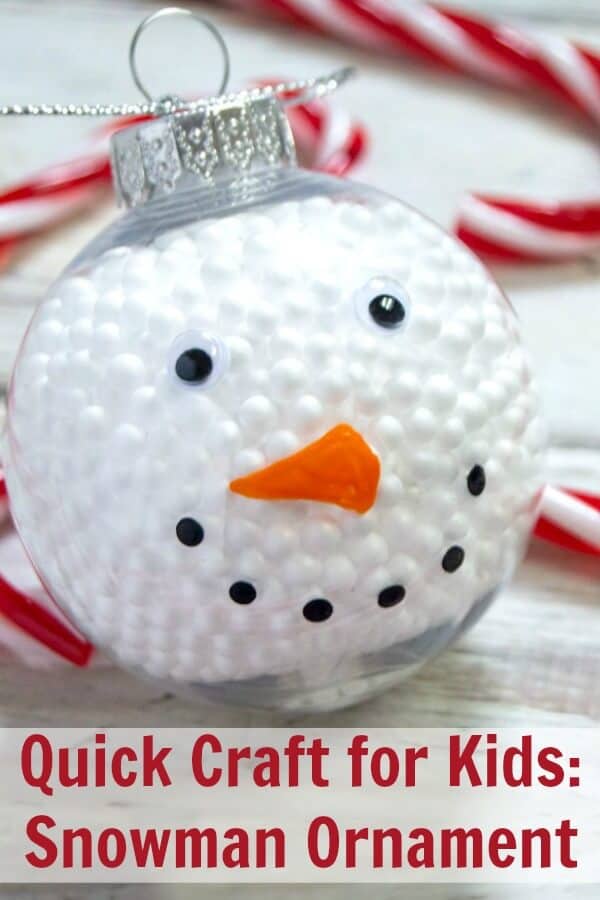 Close up of DIY snowman ornament on wood backgroun with text which reads quick craft for kids