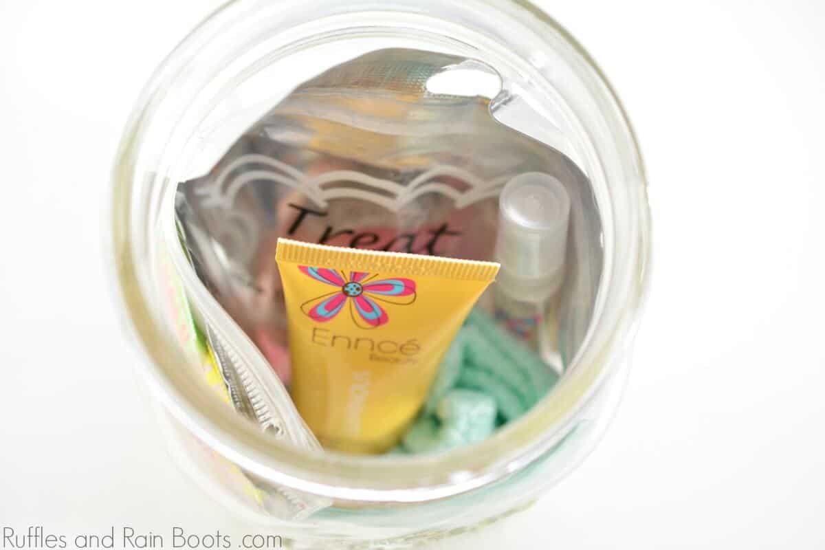 close up of filled mason jar gift for teens with pampering mini gifts