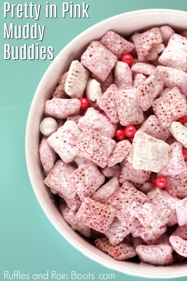 pink puppy chow Chex snack mix on teal background with text which reads perfectly pink muddy buddies