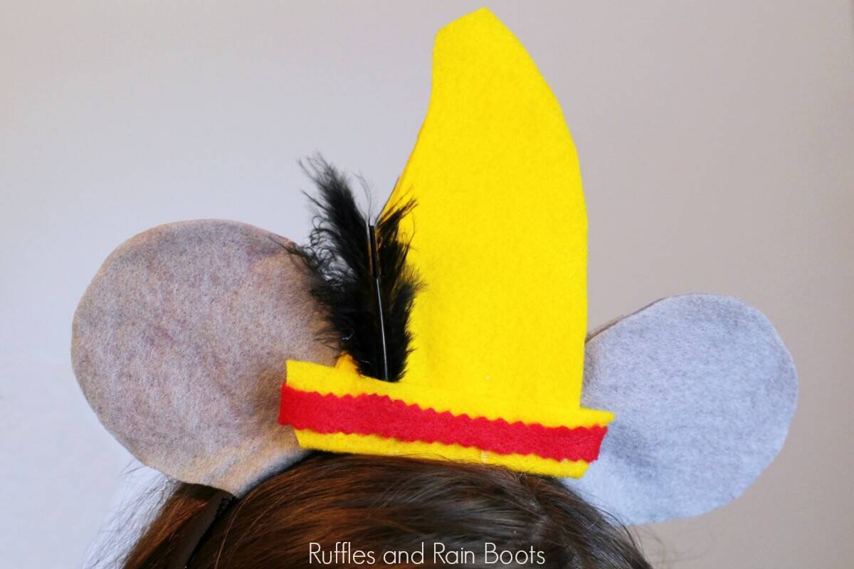 close up of Dumbo Mickey ears on little girl