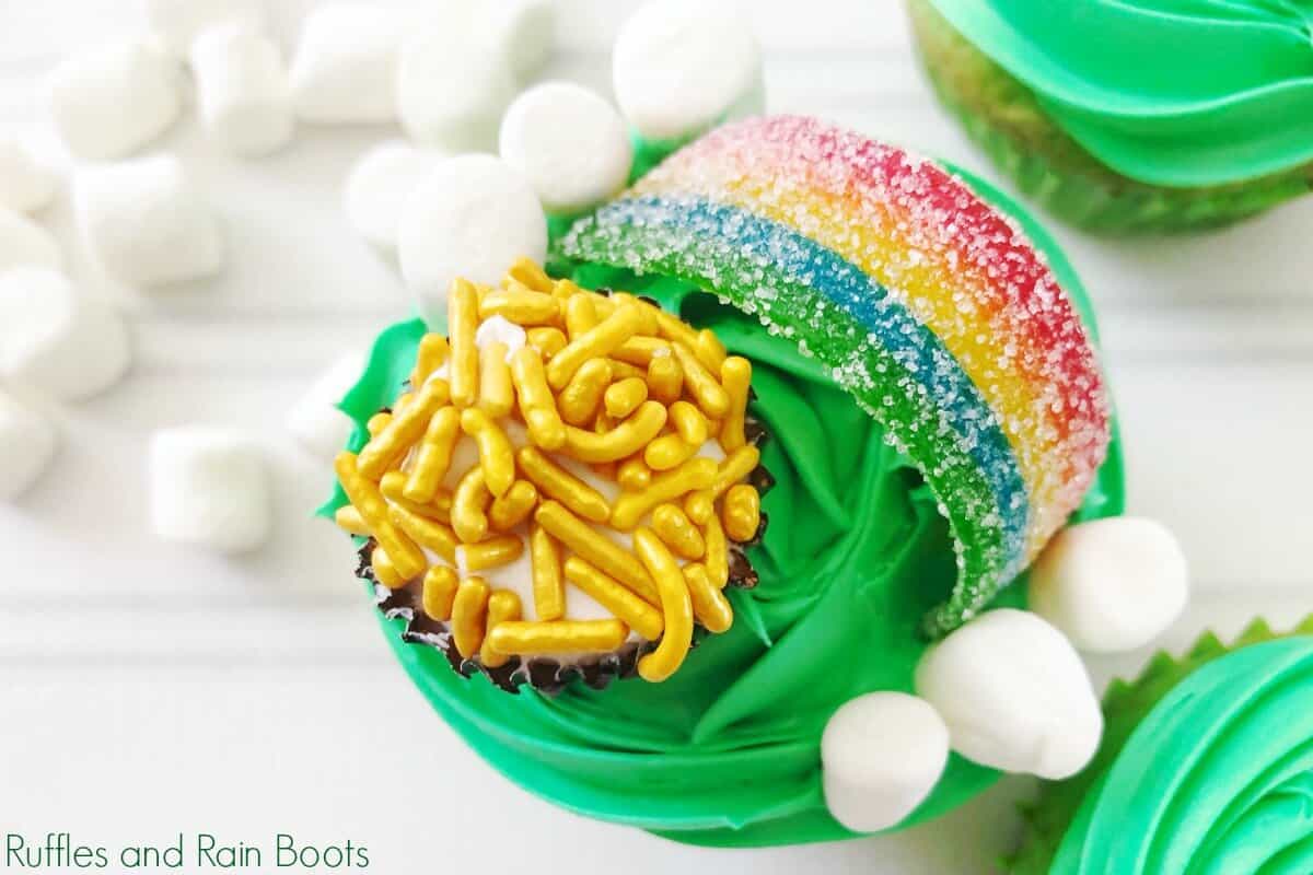 Pot of Gold Cupcakes for St Patricks day on wood background