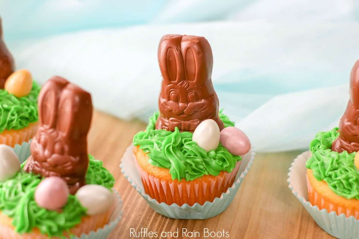 close up of chocolate bunny cupcakes on wooden table