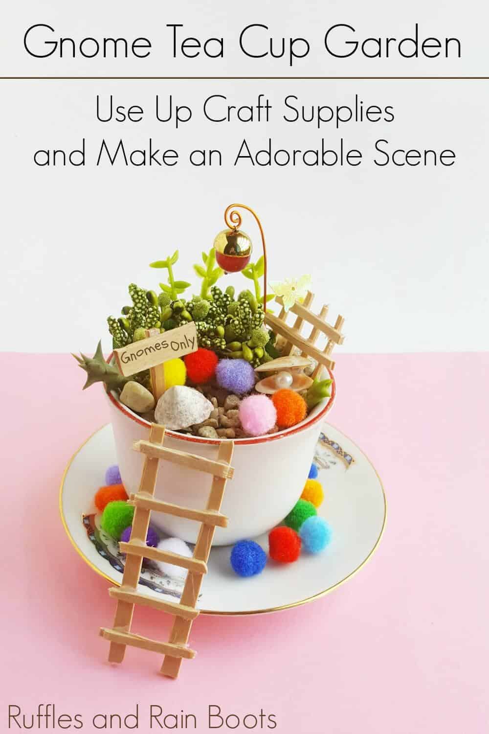 Vertical gnome teacup garden on a white and pink background with text which reads Gnome Tea Cup Garden use up craft supplies and make an adorable scene.