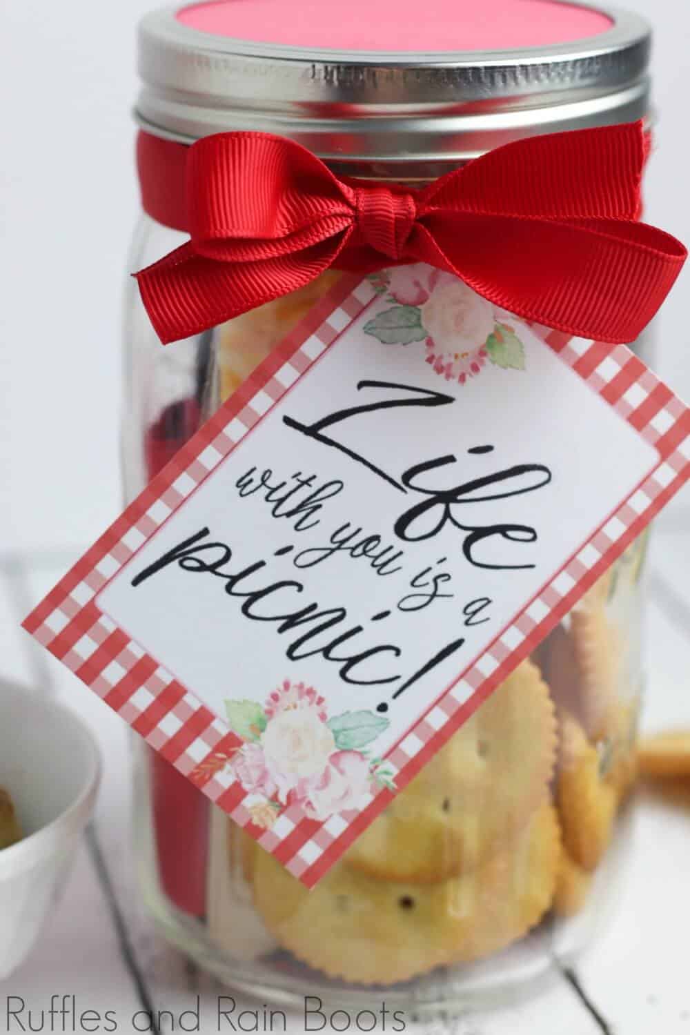 picnic date night in a jar on a white background with free printable tag which reads life with you is a picnic