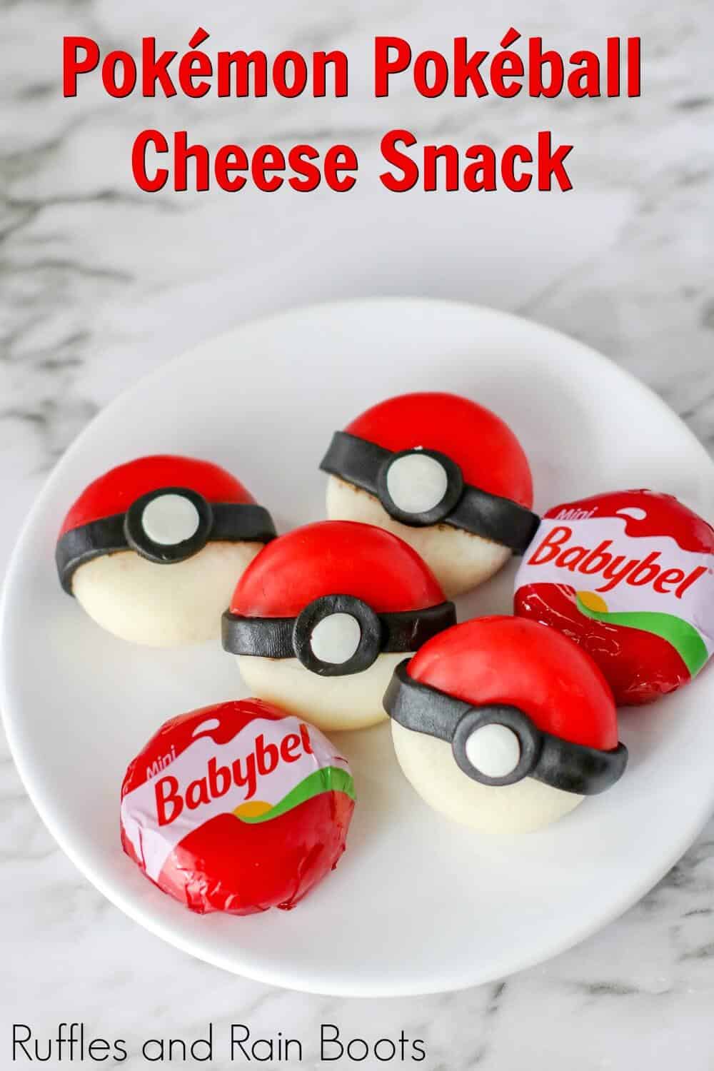 pokeball cheese snack on a plate with text which reads pokemon pokeball cheese snack