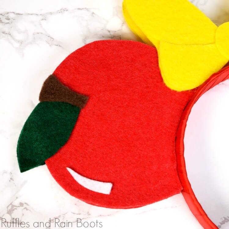 close up of Snow White apple from felt for DIY Mickey ears