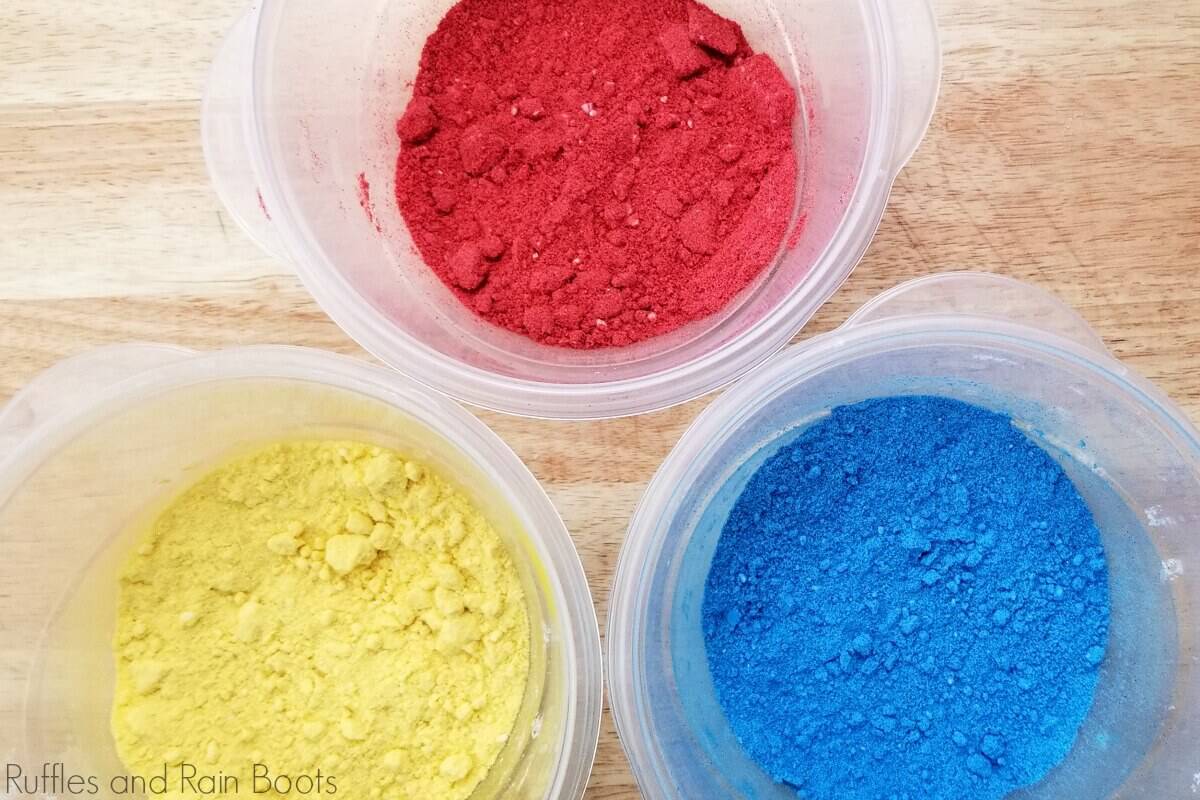 in-process step of red, yellow and blue pigmented bath bomb mix to be made into snow white bath bombs