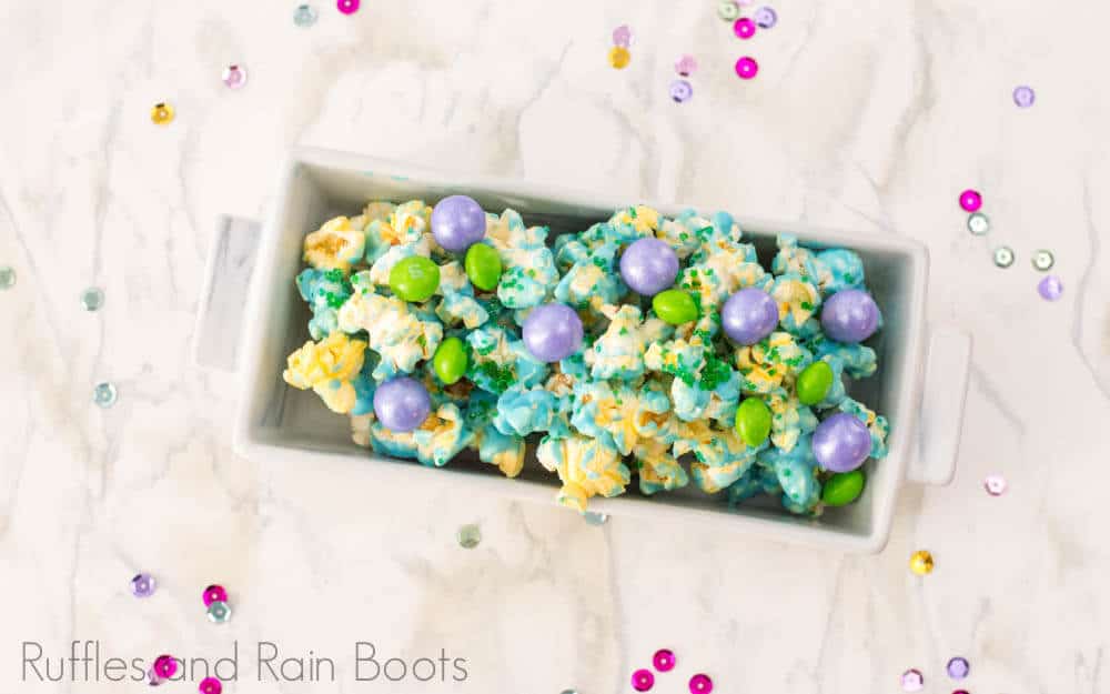 easy mermaid popcorn for party in a rectangle bowl on white background