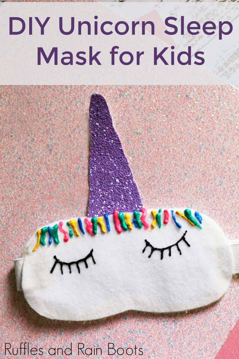 close up of unicorn sleep mask on pink table with text DIY Unicorn Sleep Mask for Kids