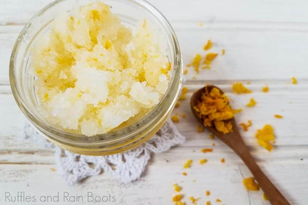 invigorating orange sugar scrub with mint on a white background