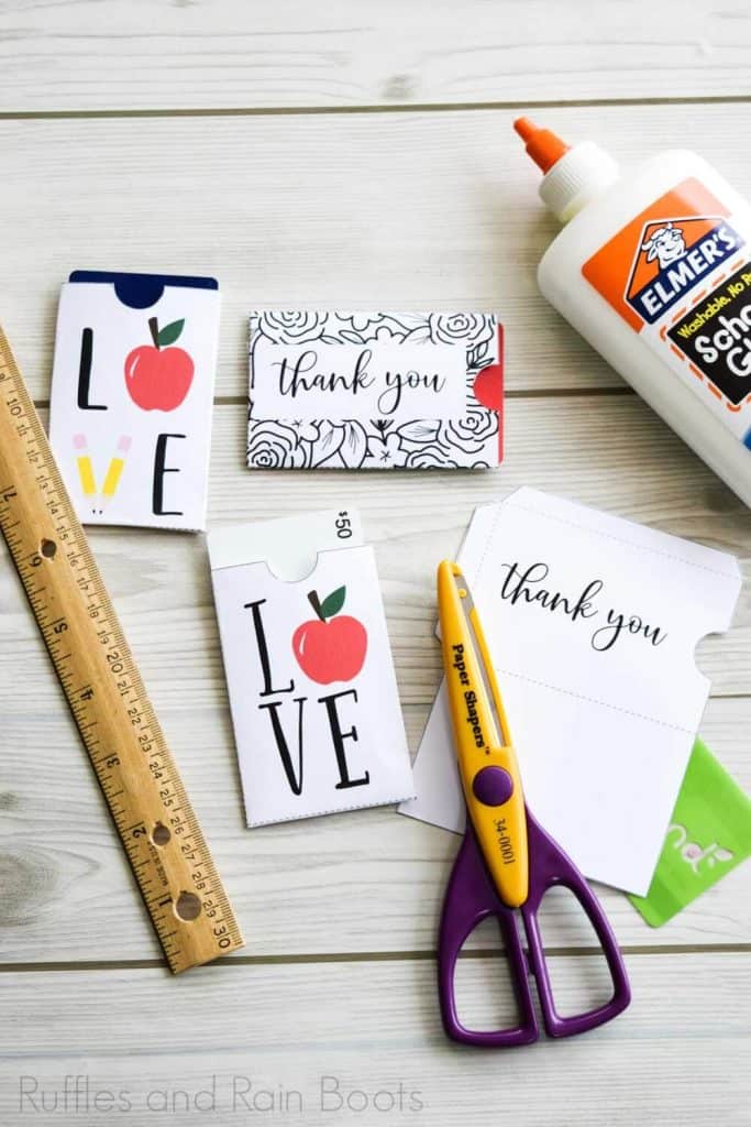 Vertical image of teacher appreciation gift card holders on a wood background.