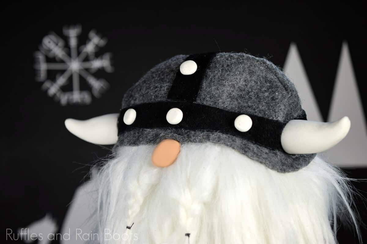 Viking gnome with gray helmet on black background