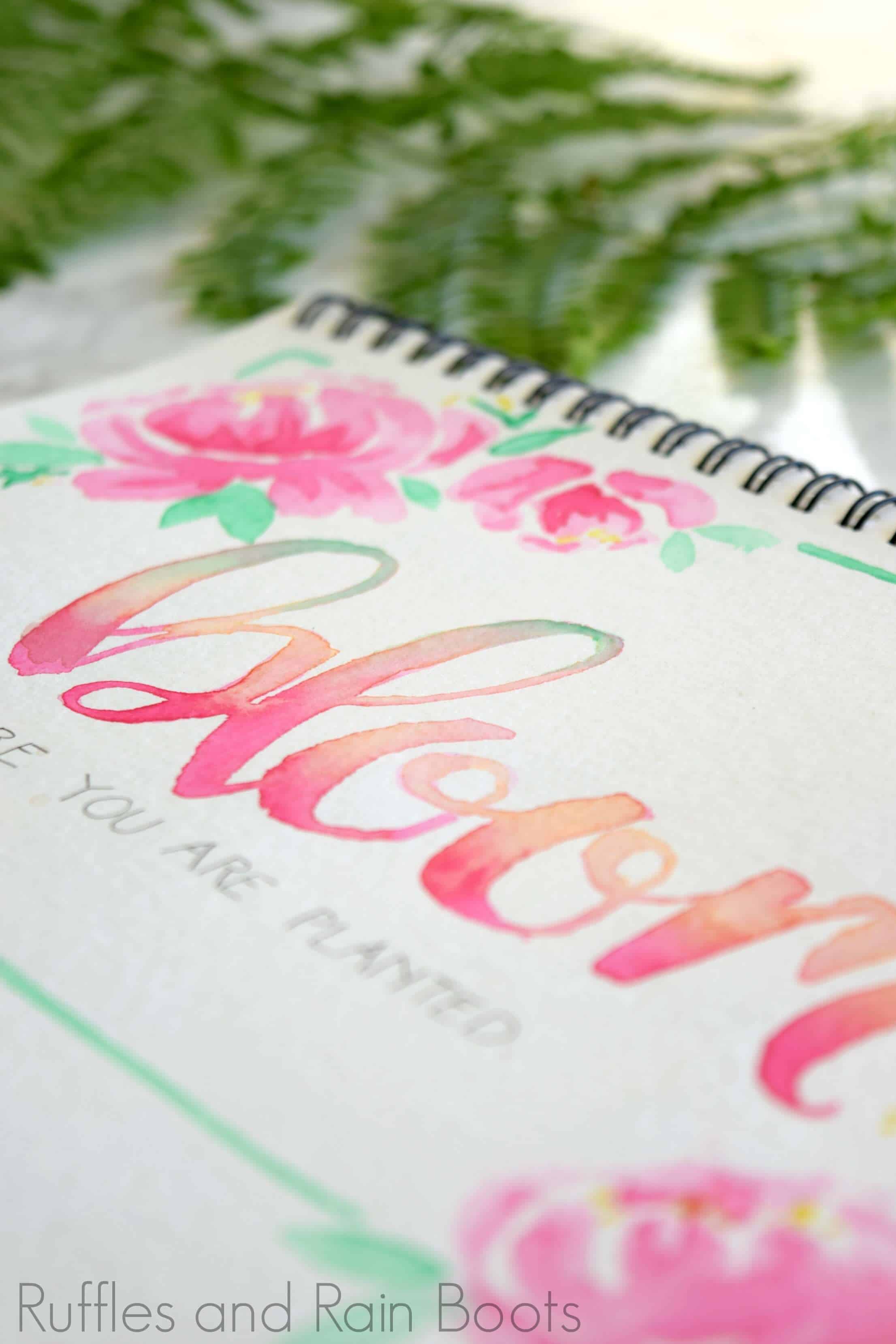close up of watercolor art with brush calligraphy