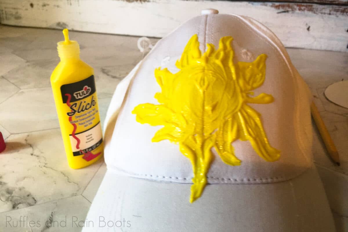 use fabric paint to paint sun on diy tangled mickey ear hat