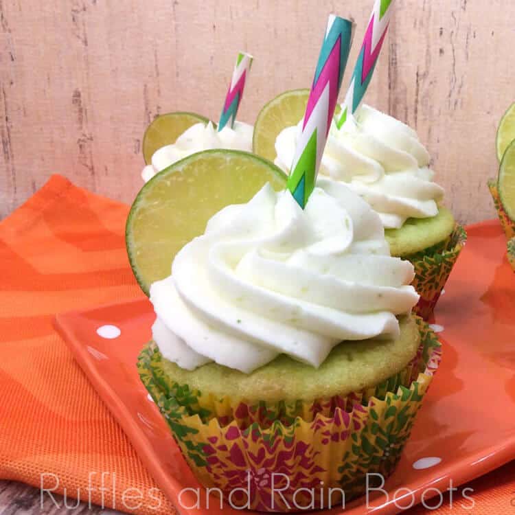 key lime cupcake recipe on a wood table with an orange linen