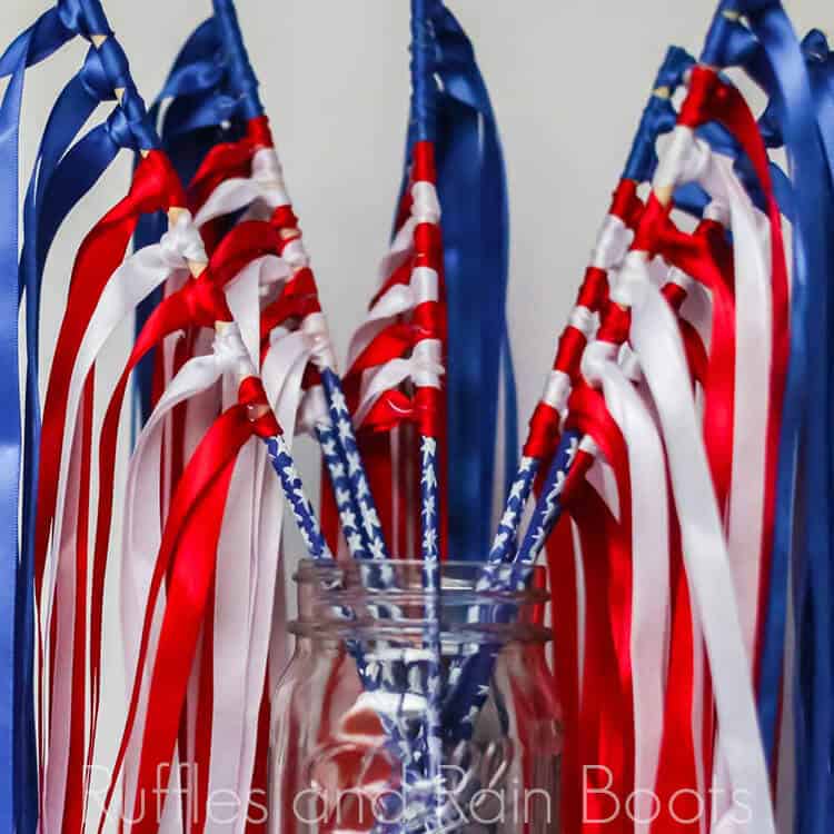 ribbon flag wands in a mason jar on a white background