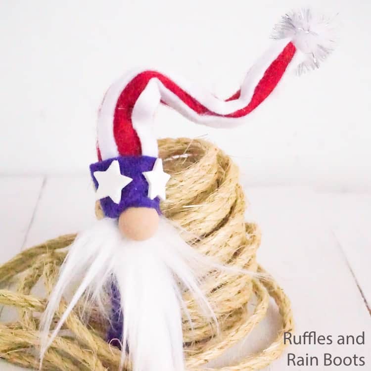 cute gnome for july 4th on a white wood table with a roll of twine