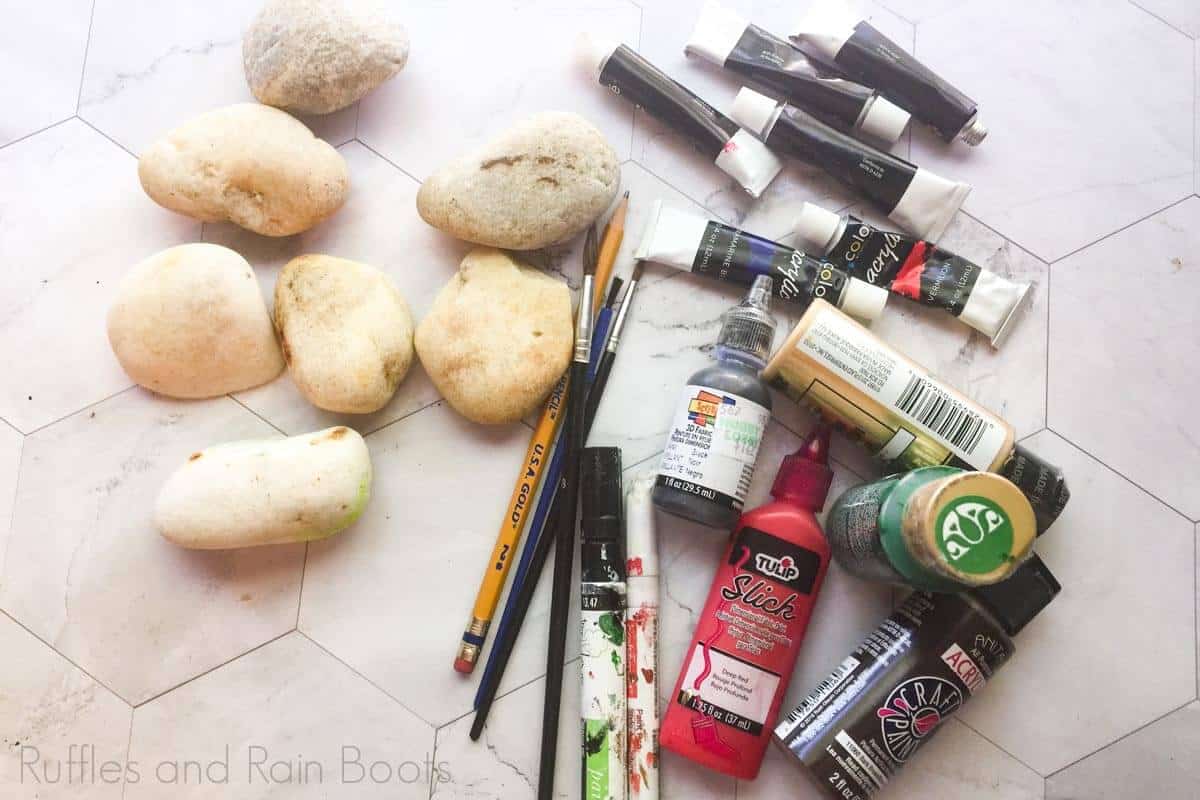harry potter rock painting supplies laid out on a white background