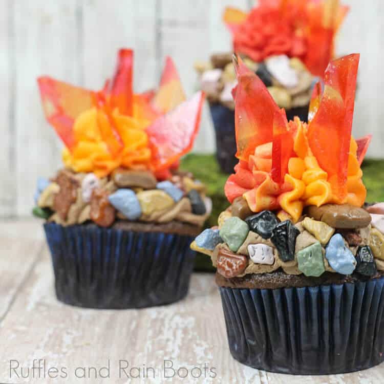 two Campfire Cupcakes Camping Cupcakes on a wood table