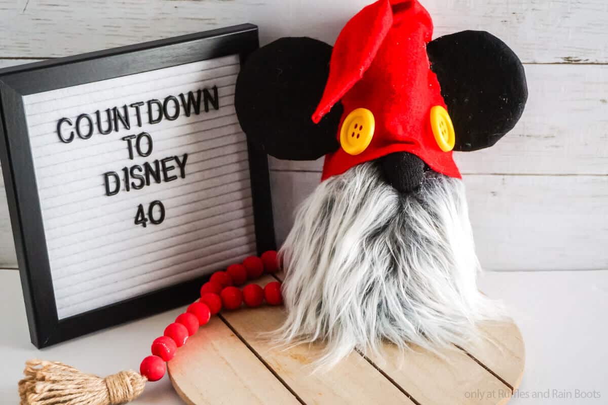 easy diy gnome with mickey ears with a letterboard with a countdown to disney vacation