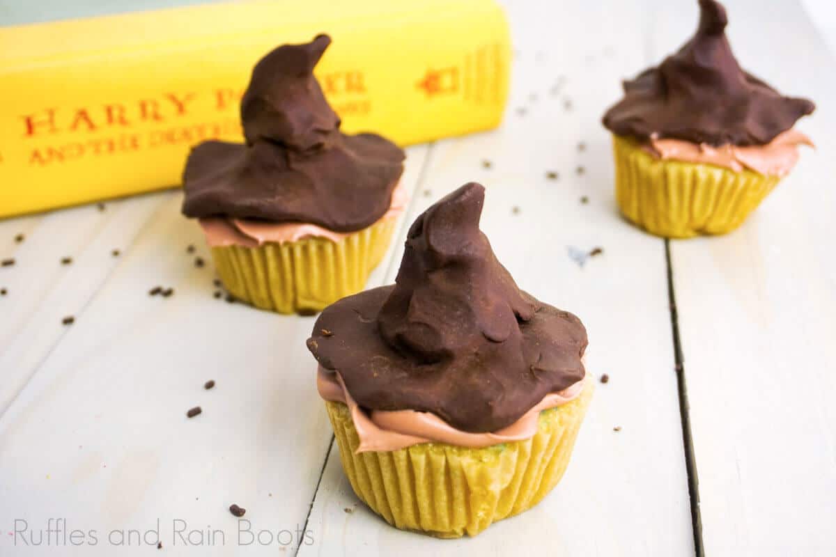 Learn to Make Hogwarts Sorting Hat Cupcakes from Harry Potter on a white wood background