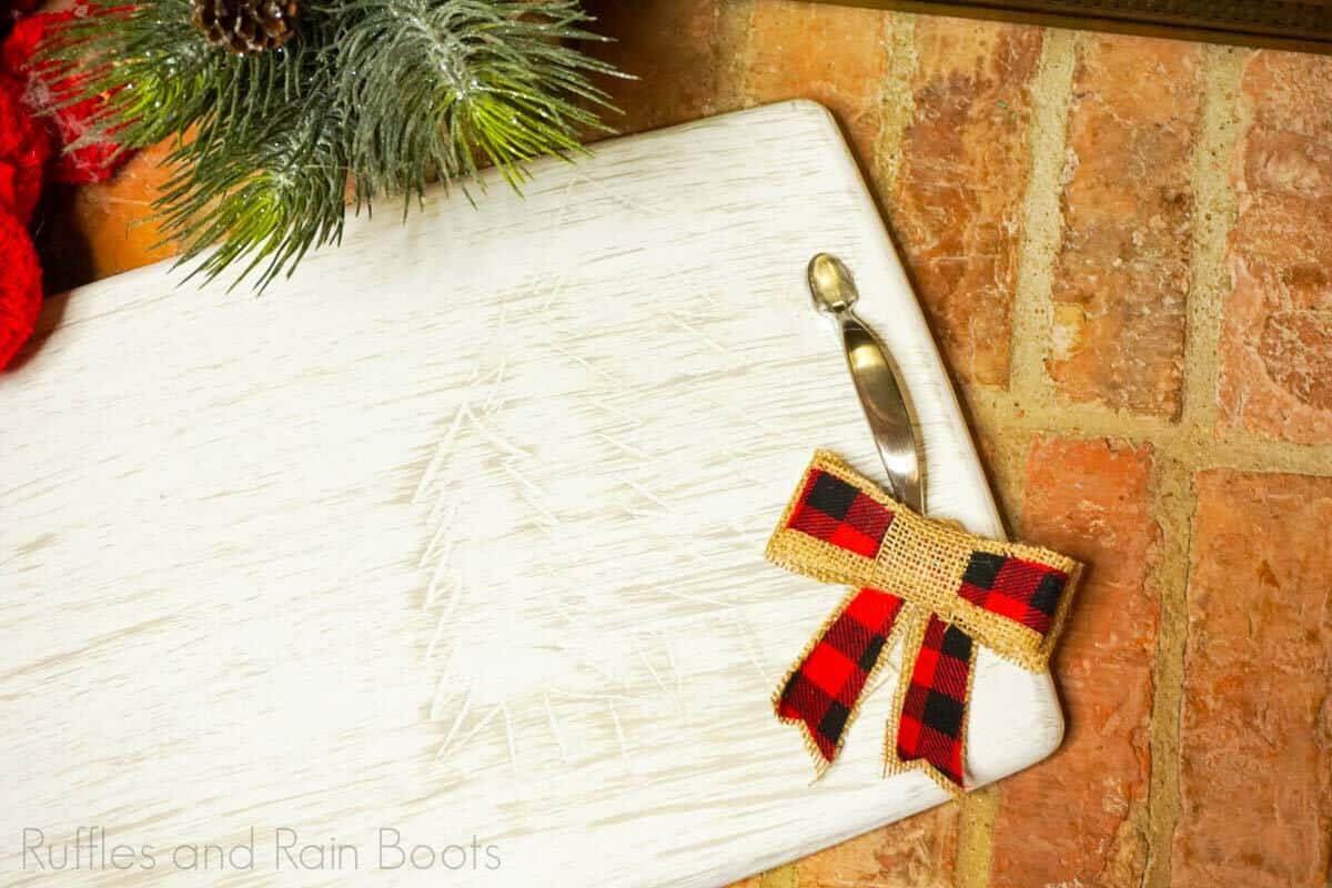Cutting Board Upcycled Carved Christmas Tray on a brick barckground