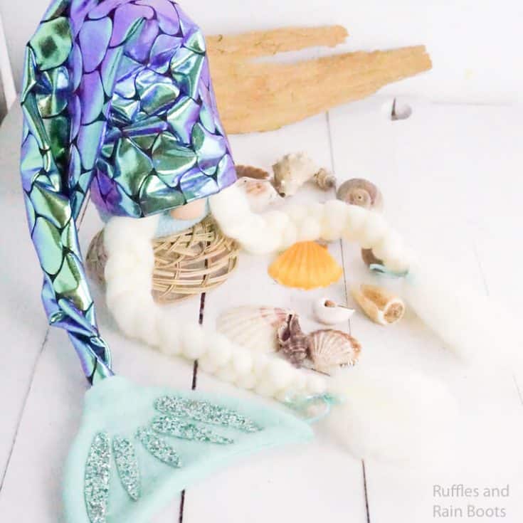 easy diy mermaid gnome on a white background with scattered shells