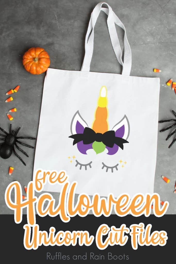 canvas bag with a unicorn cut file laying on a grey table with halloween toys scattered around with text which reads free halloween unicorn cut file