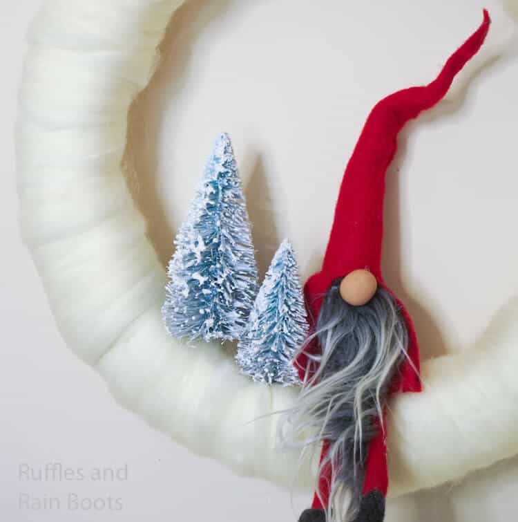 how to make a christmas wreath with a gnome on a white background