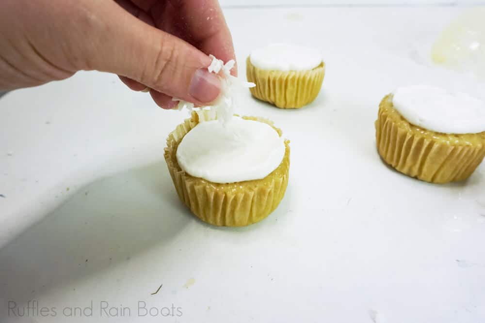 step 12 how to make snowglobe cupcakes add coconut shreds to cupcakes