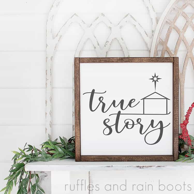 square close up image of true story Christmas SVG on white framed canvas sitting on fireplace mantle decorated for the holidays