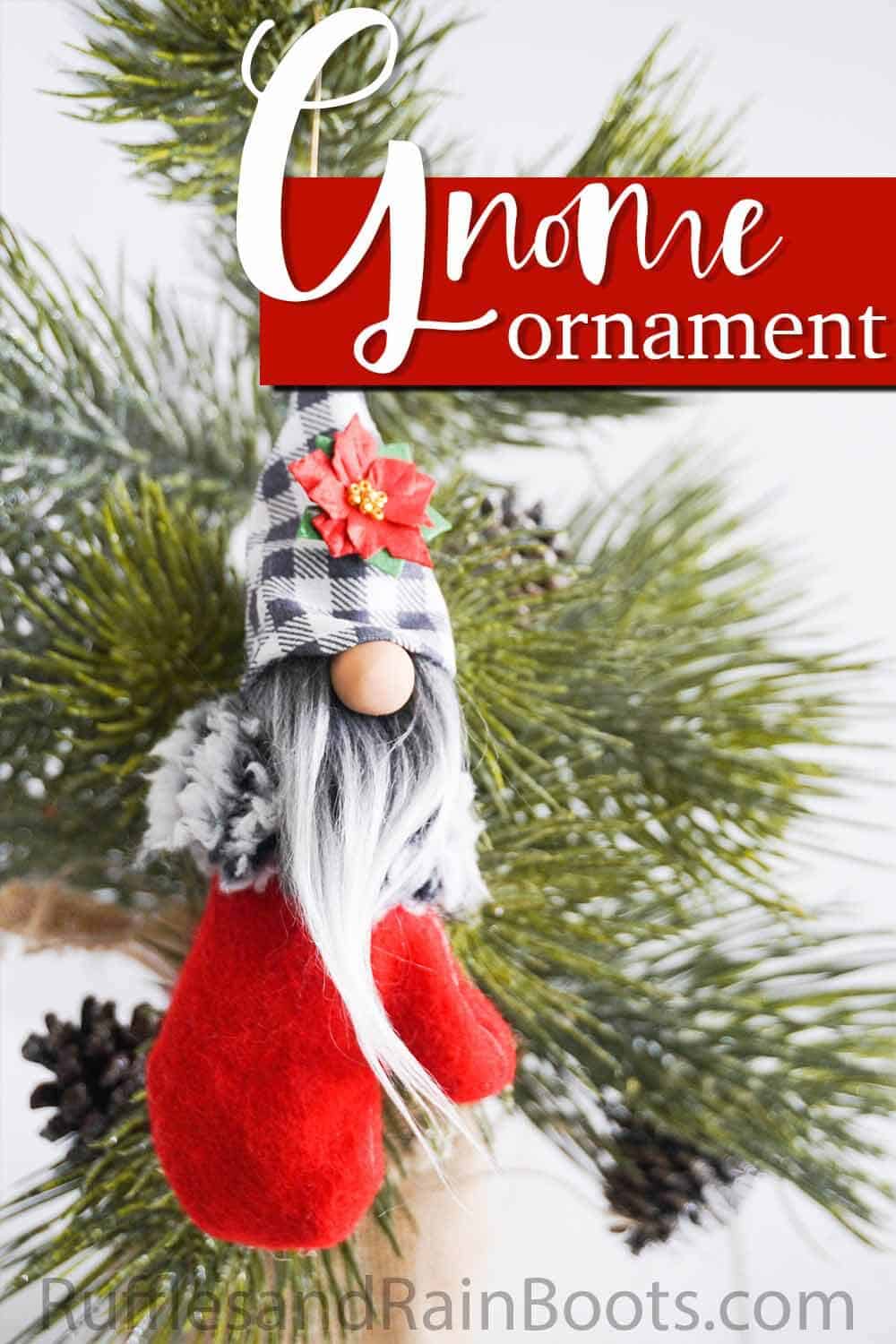 scandinavian gnome ornament hanging on a christmas tree with text which reads gnome ornament