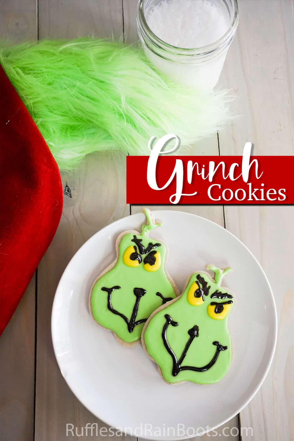 sugar cookies decorated as the grinch with text which reads grinch cookies