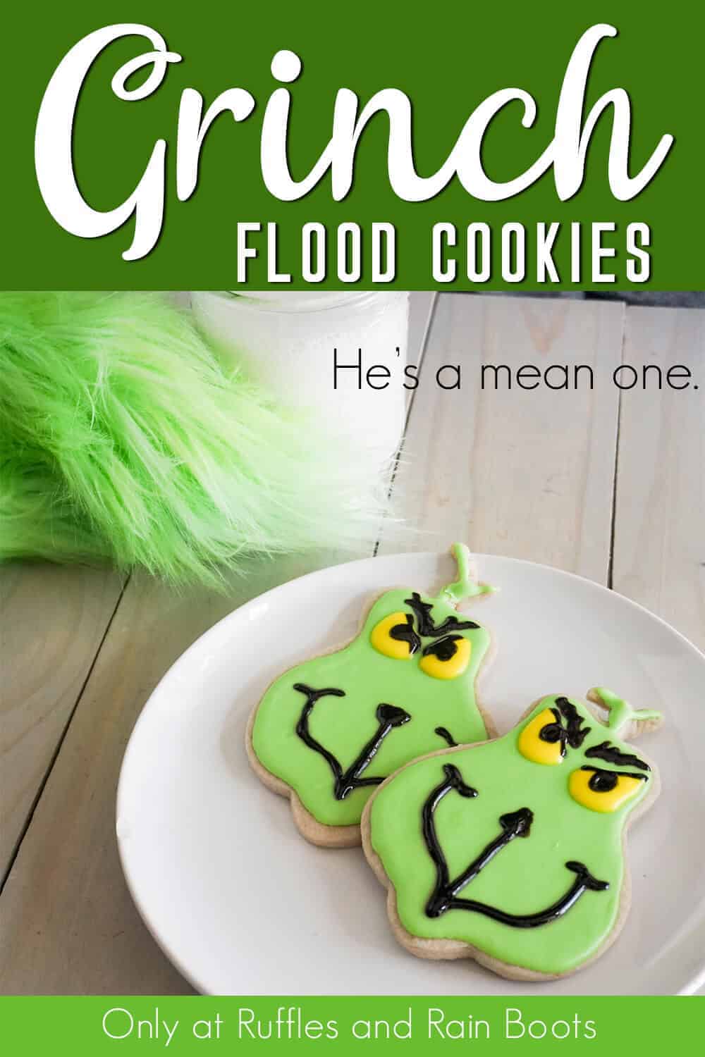 grinch iced sugar cookies on a white plate with text which reads grinch flood cookies he's a mean one