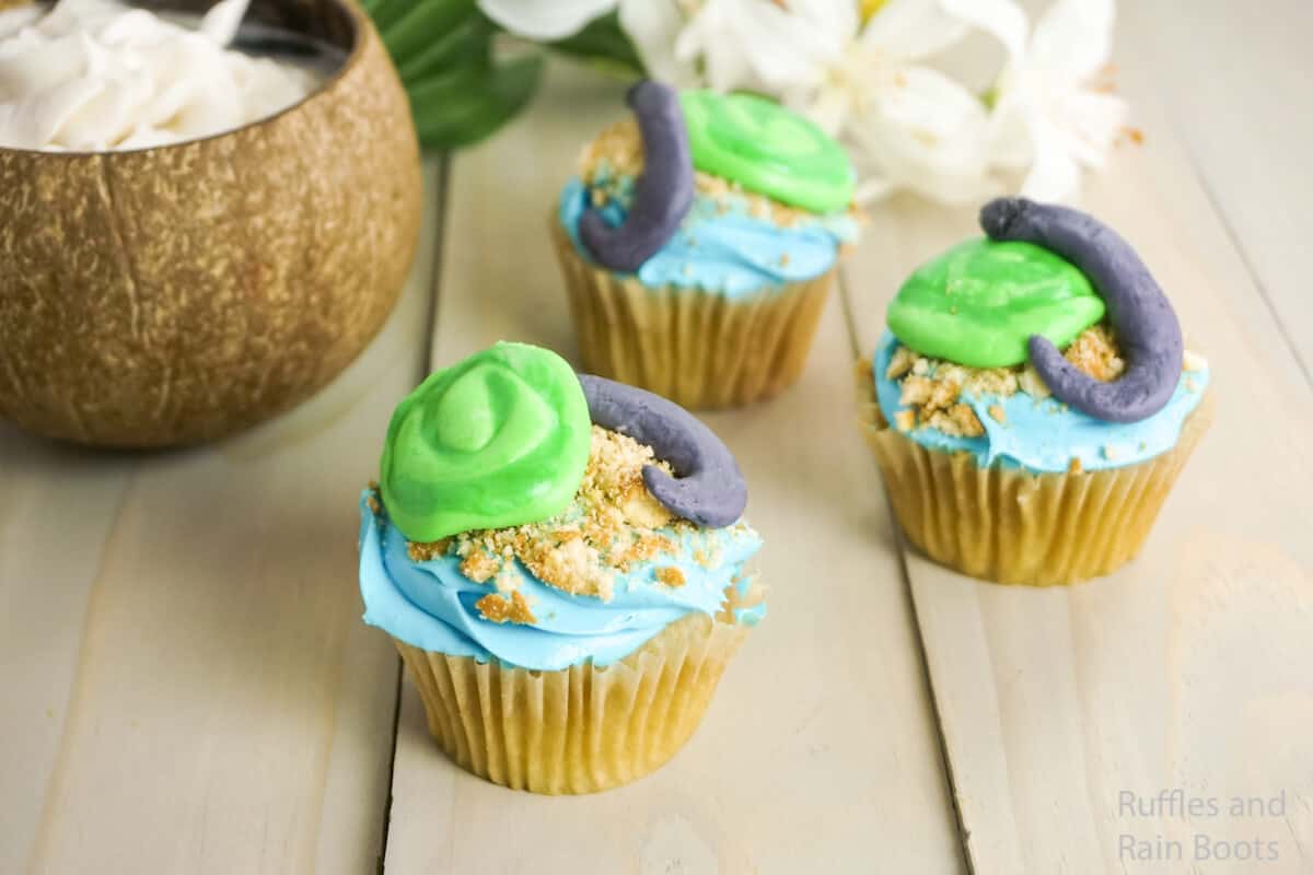 how to make moana party cupcakes on a grey wood background