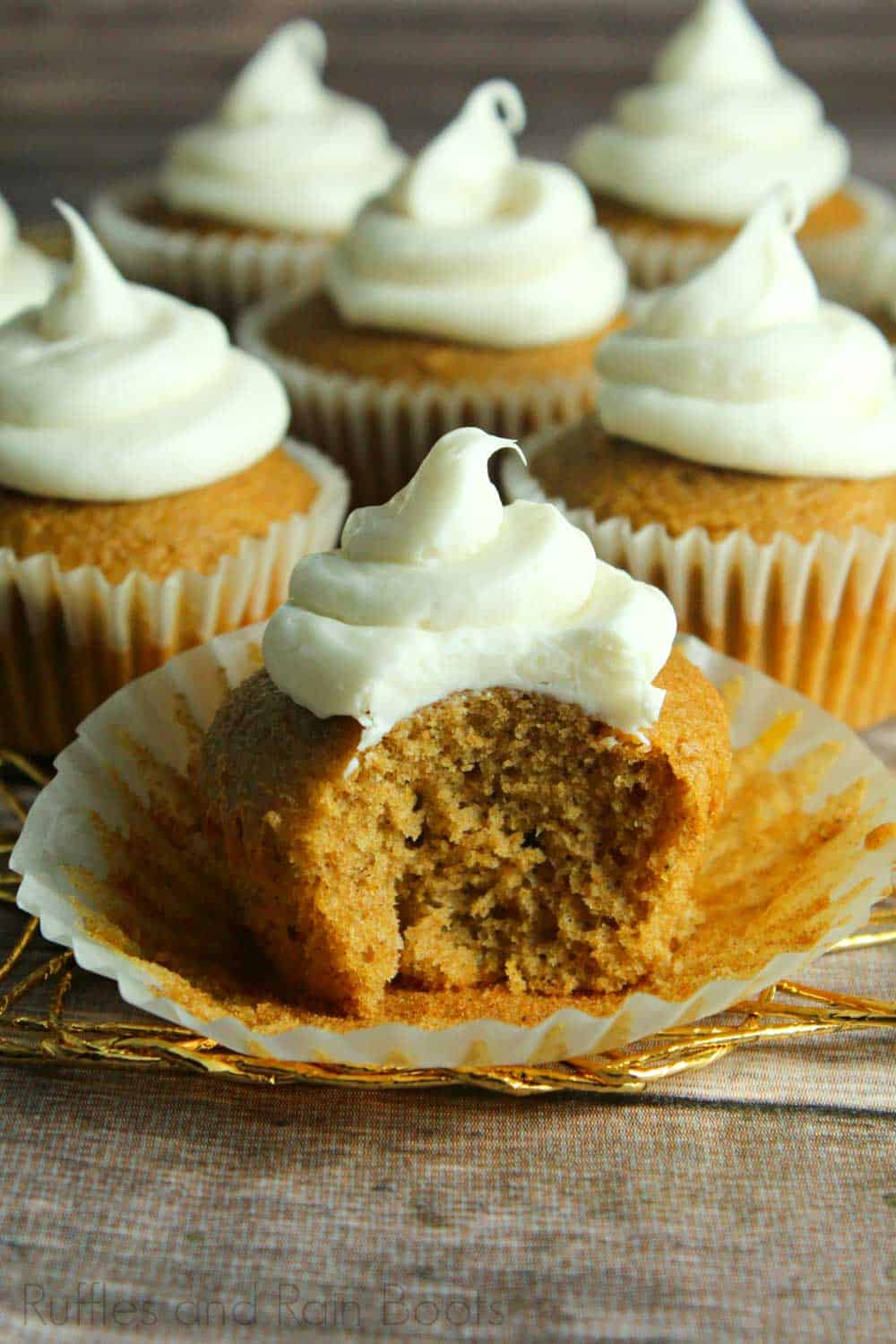 pumpkin eggnog cupcake recipe for Fall closeup of cupcake with a bite taken out