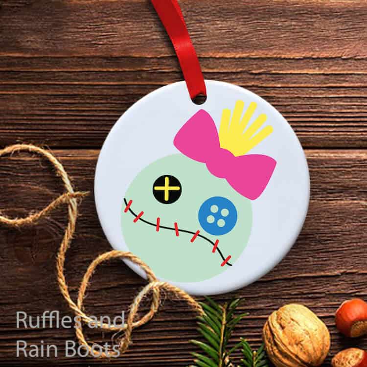 scrump lilo and stitch ornament on a wood background with some twine