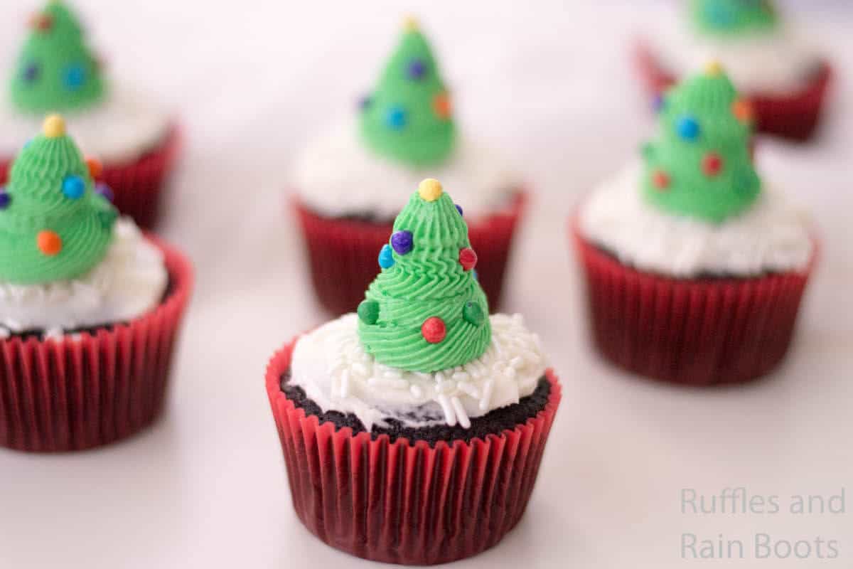 side view of easy recipe for christmas tree cupcakes on a white table