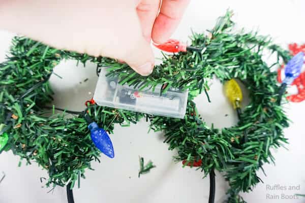 how to make christmas mickey ears by putting pices of wreath on the battery pack